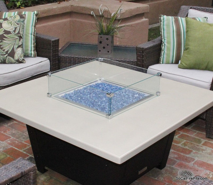 Glass wind screen with fire pit clamps installed